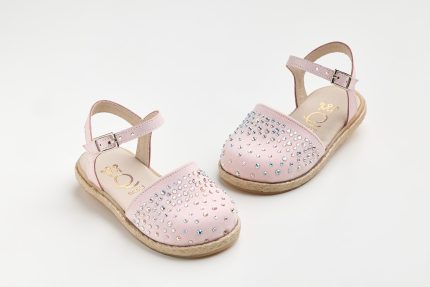 Pink kids' sandals with rhinestone embellishments and ankle strap on a white background.