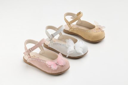 Four sparkly girls' sandals in pastel colors (pink, grey, white, tan) with rhinestones and butterfly embellishments on a white background.