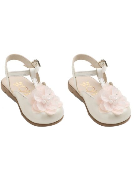 Pair of white girls' sandals with a pink fabric flower on the toe and ankle strap.