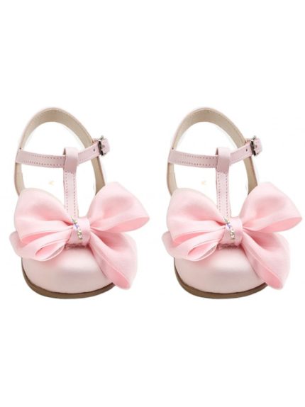 Pair of pink baby girl Mary Jane shoes with large satin bows and small rhinestone accents.
