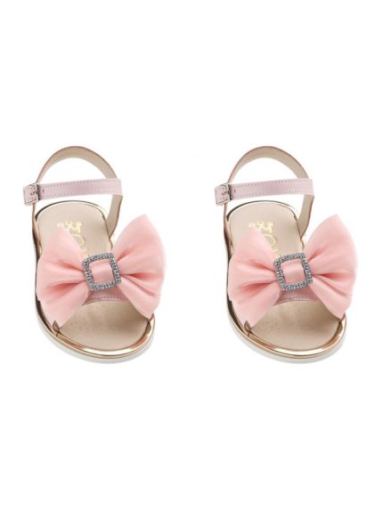 Pair of pink baby sandals with a large pink bow and rhinestone buckle, facing forward side by side with ankle straps.