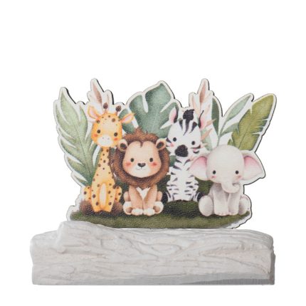Decorative cake topper with four cartoon animals—a giraffe, lion, zebra, and elephant—on a grassy base with leafy backdrop.