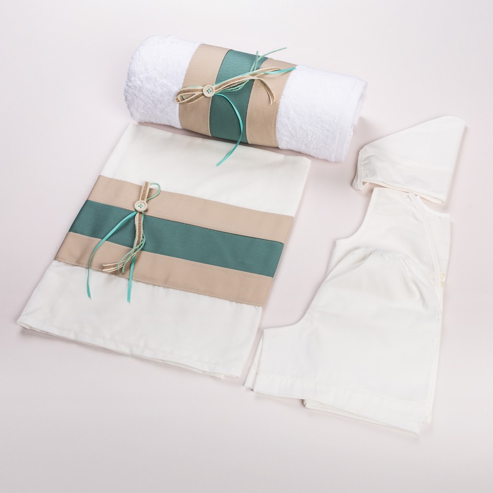 1300277_1-1000x1000 | La Vie en Rose Gift-ready set of white linens: rolled towels and folded sheet with teal and beige stripes, tied with twine on a pale background.