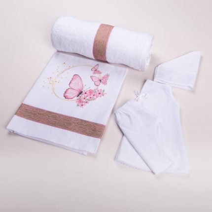 Baby care set with white towel rolled and pink lace bands, white floral blanket featuring pink butterflies, and white baby clothing pieces with lace edging