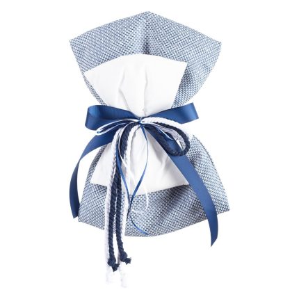 Gift wrapped in blue patterned fabric with white tissue and a navy ribbon bow