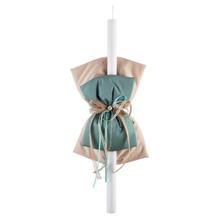 Tall white candle wrapped with a beige and teal fabric bow, tied with twine decorations for a decorative look.