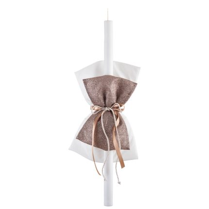 Decorative white pillar candle wrapped with white and rose-gold fabric and ribbons for a festive look
