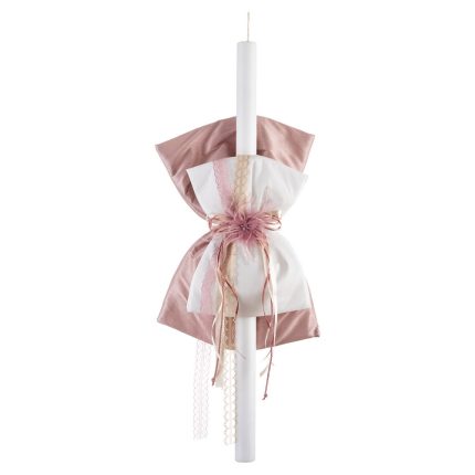 Tall white taper candle wrapped with pink and white fabric ribbons and lace, used as a decorative ceremony accent.