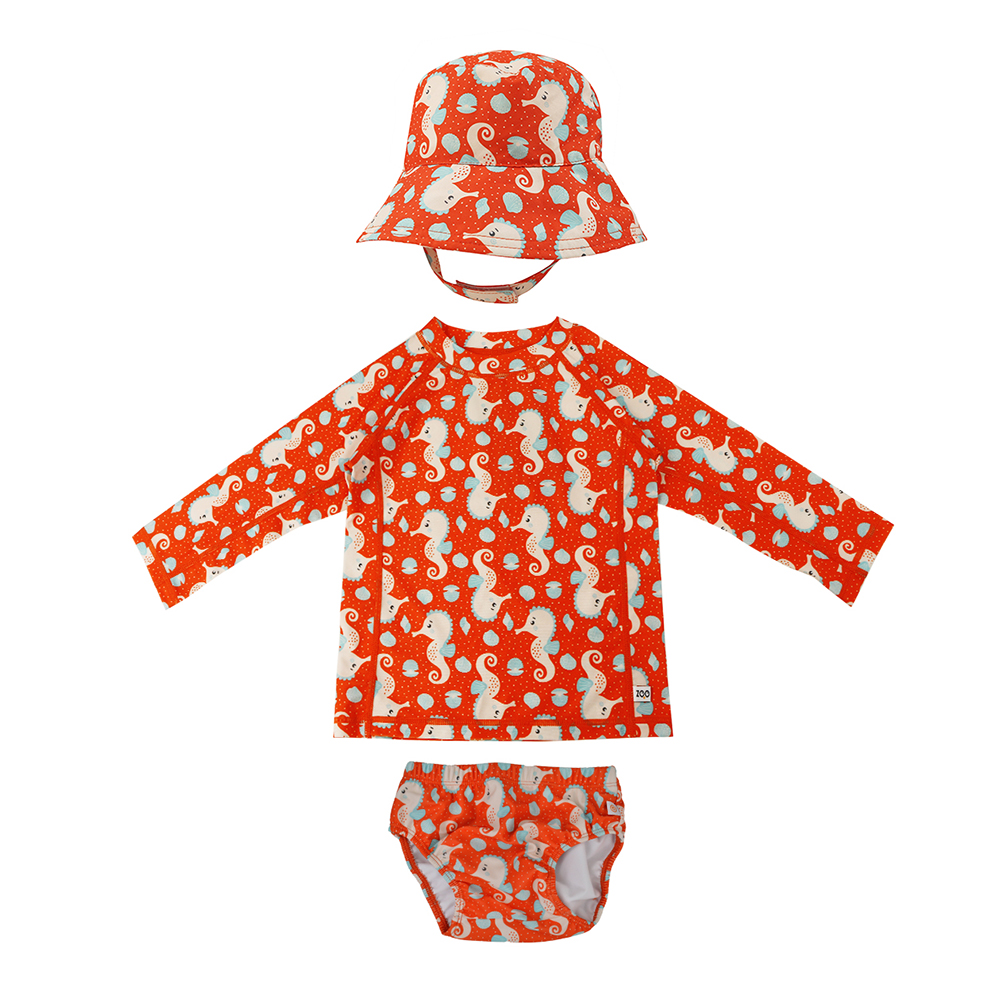 ZOO16024_Seahorse | La Vie en Rose Matching orange swim set for baby: long-sleeve top, hat, and diaper cover with white seahorse pattern.