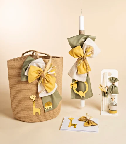 Decorative gift set with a woven basket, tall candle, and ribbons in green, white, and mustard, adorned with gold animal shapes.