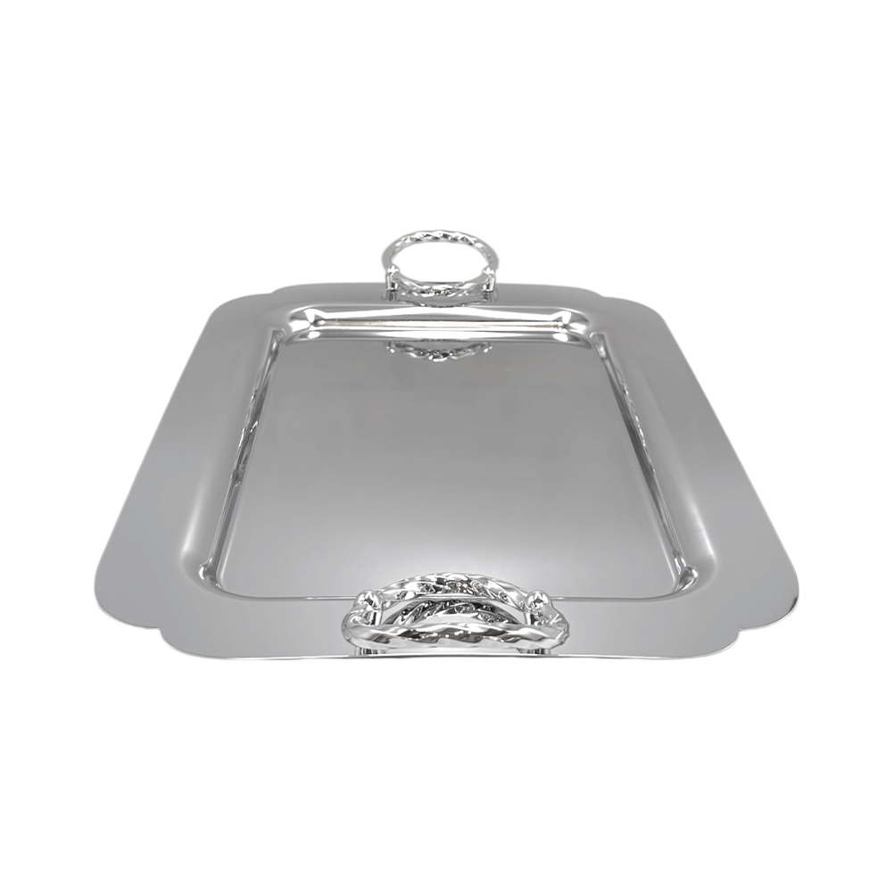 057D6415-10F9-61D2-C5A6-019DBA135C53_2 Polished silver rectangular serving tray with decorative handles on each end, viewed from above.