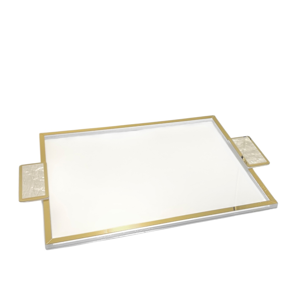 364DFC75-D1C7-4759-EA60-019DAFA38CF7_1 Rectangular vanity tray with gold metal frame and two side handles on a white surface, decorative and glossy.