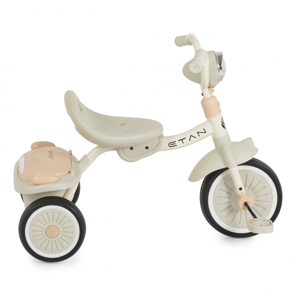 7462817-1000x1000 Cream-colored three-wheeled kids' ride-on bike with a soft beige seat and handlebars.