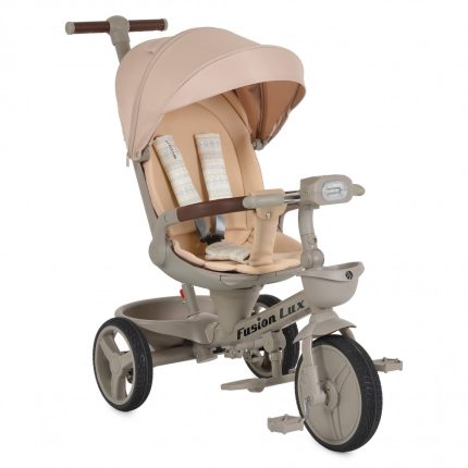 Beige children’s tricycle with a sun canopy, padded seat, and safety harness; labeled Fusion Lux.
