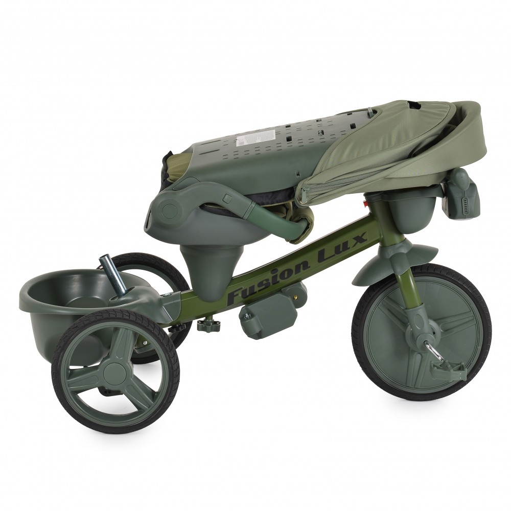 7462830-1000x1000 Green children's tricycle with a rear storage bin and a foldable canopy, labeled Fusion Lux, olive-green color.