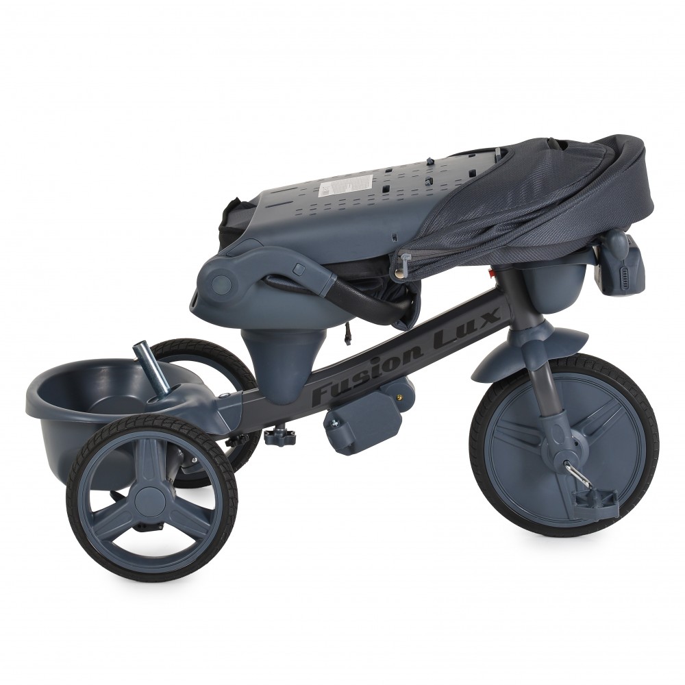 7462833-1000x1000 Gray three-wheeled stroller/tricycle for a young child, with a storage bucket at the rear and a folded seat cover on top.
