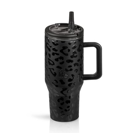 Black leopard-pattern travel tumbler with lid and straw, standing upright on a white background.
