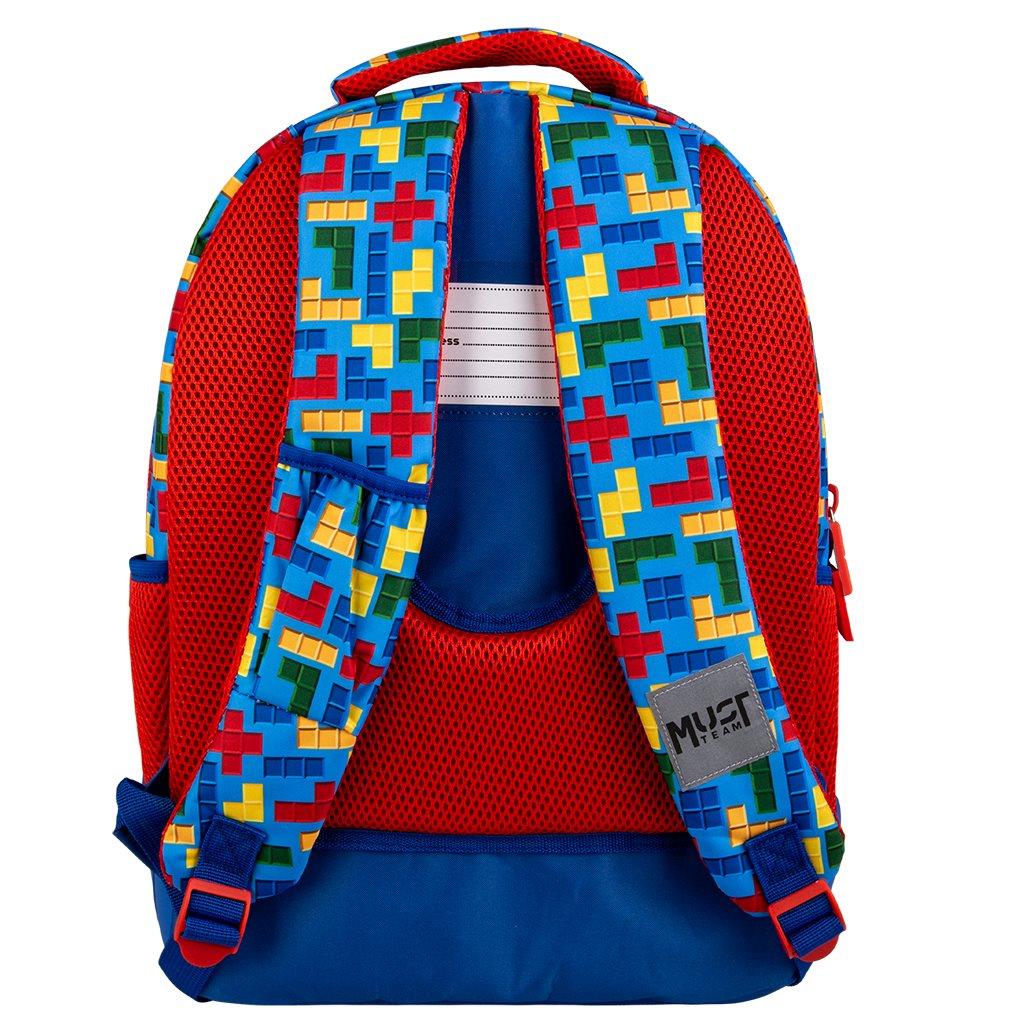 000586175_1 | La Vie en Rose Colorful kids' backpack with red mesh back and blue base; patterned blue straps with multicolor Tetris-like blocks, side pocket, and a small gray MUST patch on strap.