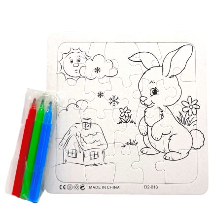 Puzzle board showing a cartoon bunny in a garden with a small cottage, sun, clouds, and flowers; red, green, and blue markers are in a plastic sleeve beside it.