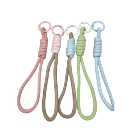 Six pastel braided dog leashes with metal rings arranged in a row, for pets or dogs.