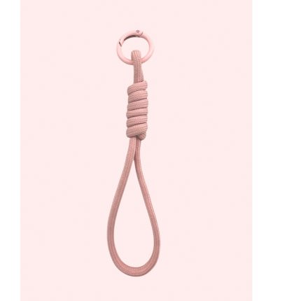 Pink rope loop with a metal ring at the top, tied in a knot, hanging against a pale pink background (decorative accessory)