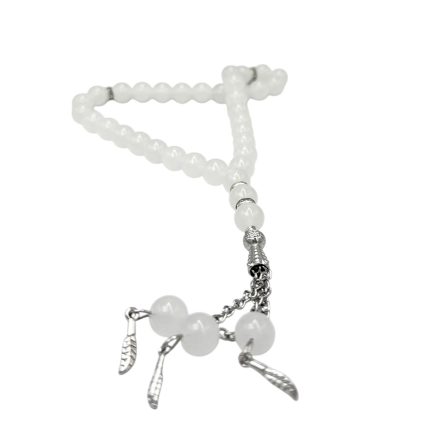 White beaded rosary with silver-toned leaf charms and chain accents.