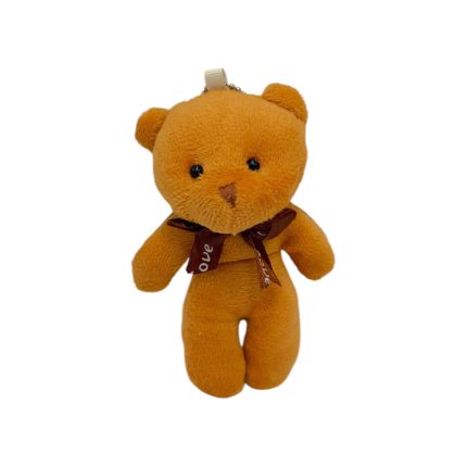 Orange plush teddy bear with a brown ribbon bow around its neck, standing upright. It has black eyes and a stitched nose.