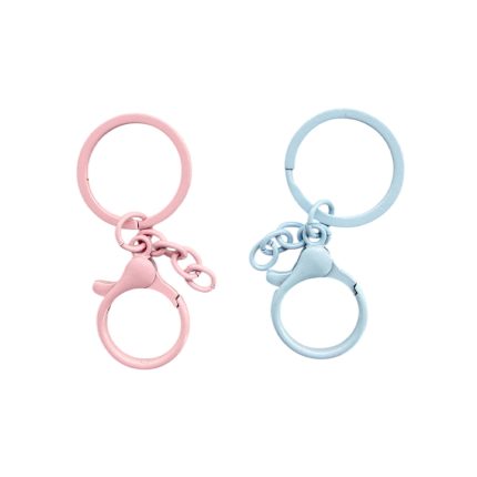Two pastel keychains (pink on the left, light blue on the right) with dual rings and small linked chains, set against a white background.