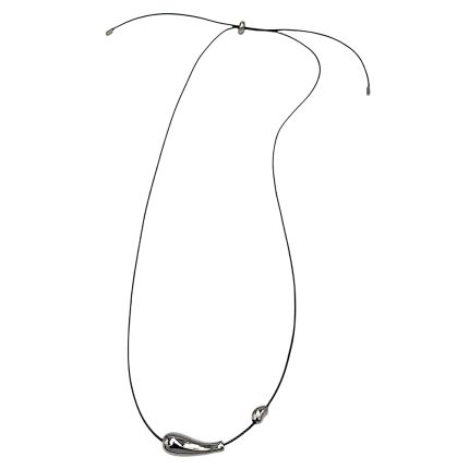 Black cord necklace featuring a curved silver pendant at the bottom and small silver beads near the ends.