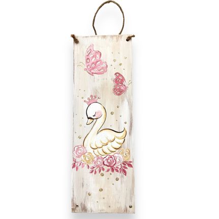 Vertical distressed wooden wall plaque featuring a white swan surrounded by pink butterflies and roses, with a rope hanger at the top.