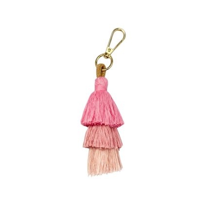 Gold-tone lobster clasp keychain with three layered pink tassels (hot pink, pink, peach) hanging from a tan loop