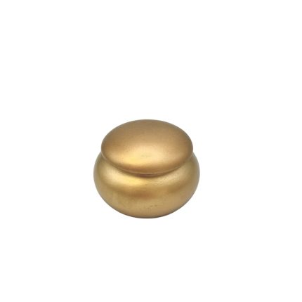 Gold-toned double bead or small decorative pellet on a white background, with a smooth, rounded shape and seam between the pieces