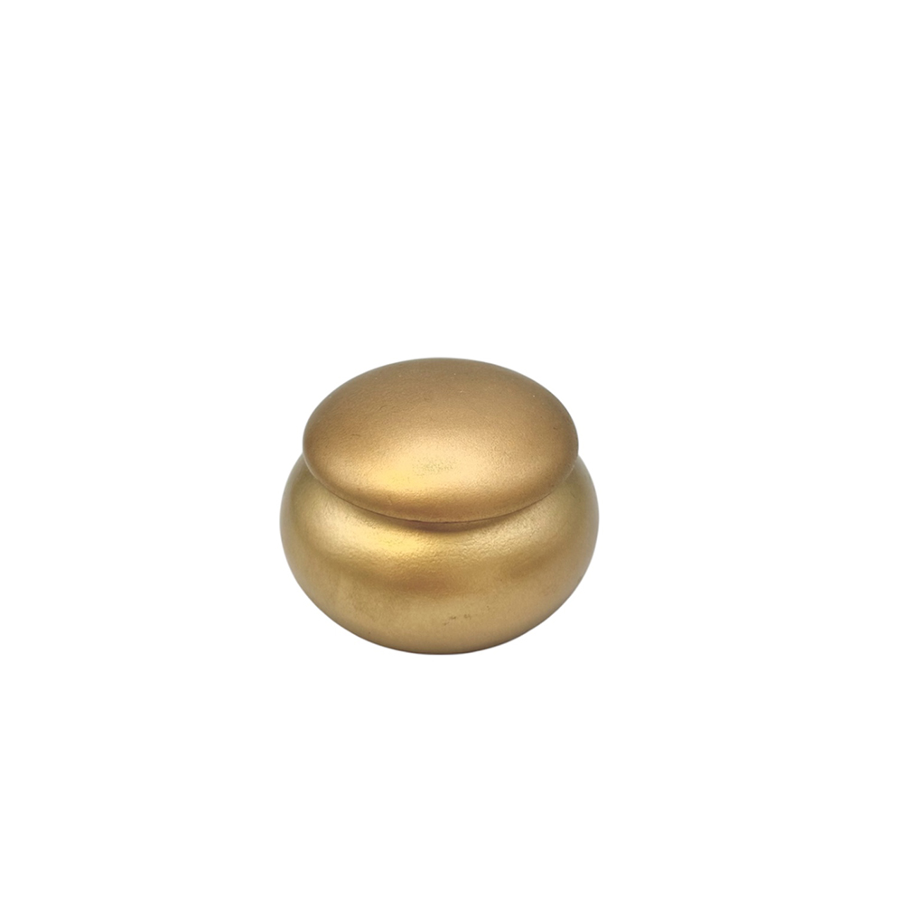 68222F7E-68E1-7150-845B-019CDBA94DB7_11 | La Vie en Rose Gold-toned double bead or small decorative pellet on a white background, with a smooth, rounded shape and seam between the pieces