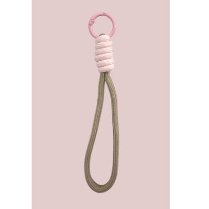 Pink circular ring at the top wrapped with pink cord, attached to a long beige rope loop — a decorative keychain or lanyard accessory