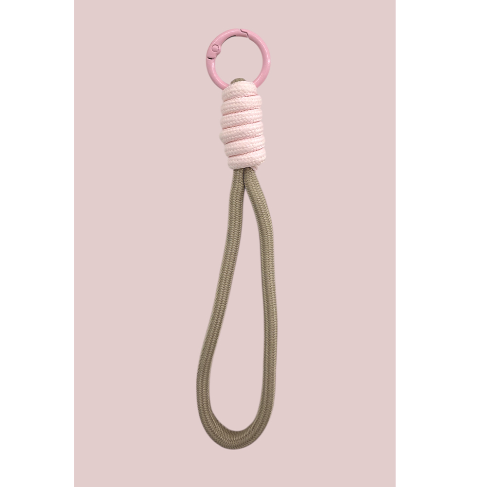 6C5E085B-3AF3-3D2E-FE0F-019D29D2B9D6_11 | La Vie en Rose Pink circular ring at the top wrapped with pink cord, attached to a long beige rope loop — a decorative keychain or lanyard accessory