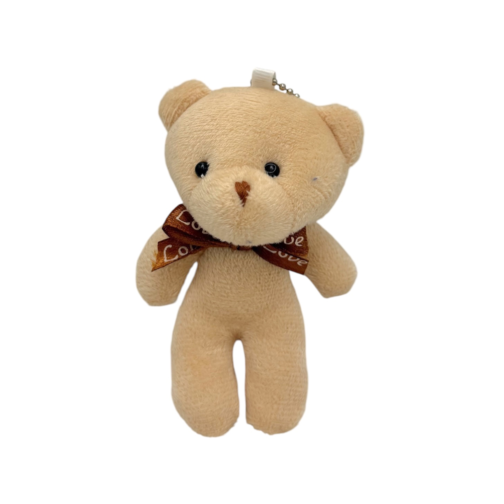 74625C74-A9F3-CA8D-58C7-019EABE19C8A_11 | La Vie en Rose Beige plush teddy bear with a brown ribbon saying 'Love' around its neck, small black eyes, and a white keychain loop on top.