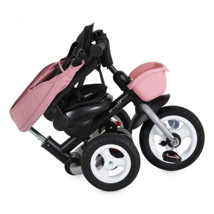 Three‑wheeled baby stroller with pink canopy and pink front basket on a black frame, shown folded for compact storage.