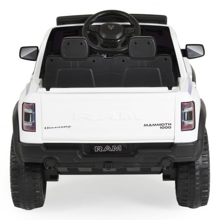 Rear view of a white toy RAM Mammoth 1000 with black interior and large off-road tires, shown from behind.
