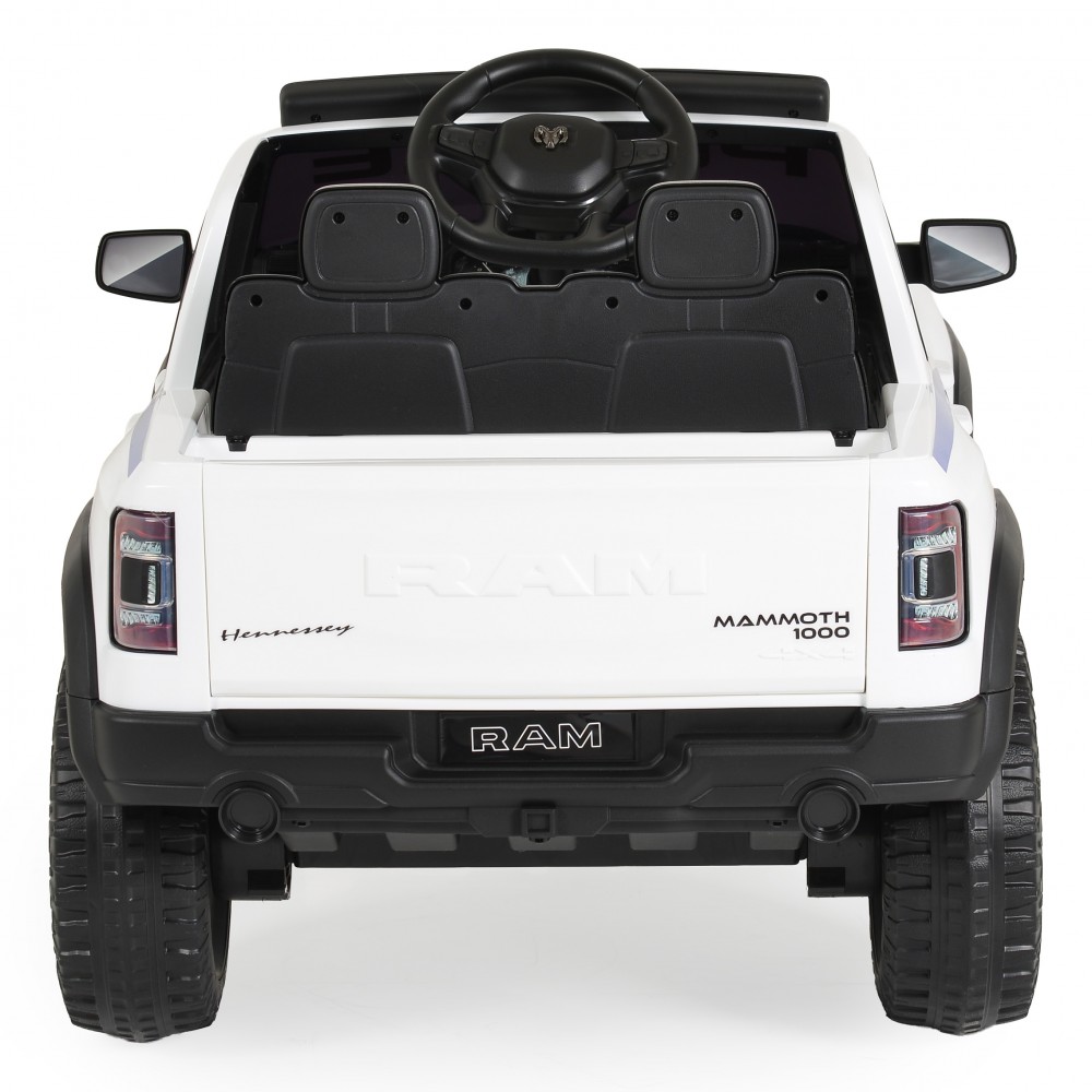 7463160-1000x1000 | La Vie en Rose Rear view of a white toy RAM Mammoth 1000 with black interior and large off-road tires, shown from behind.