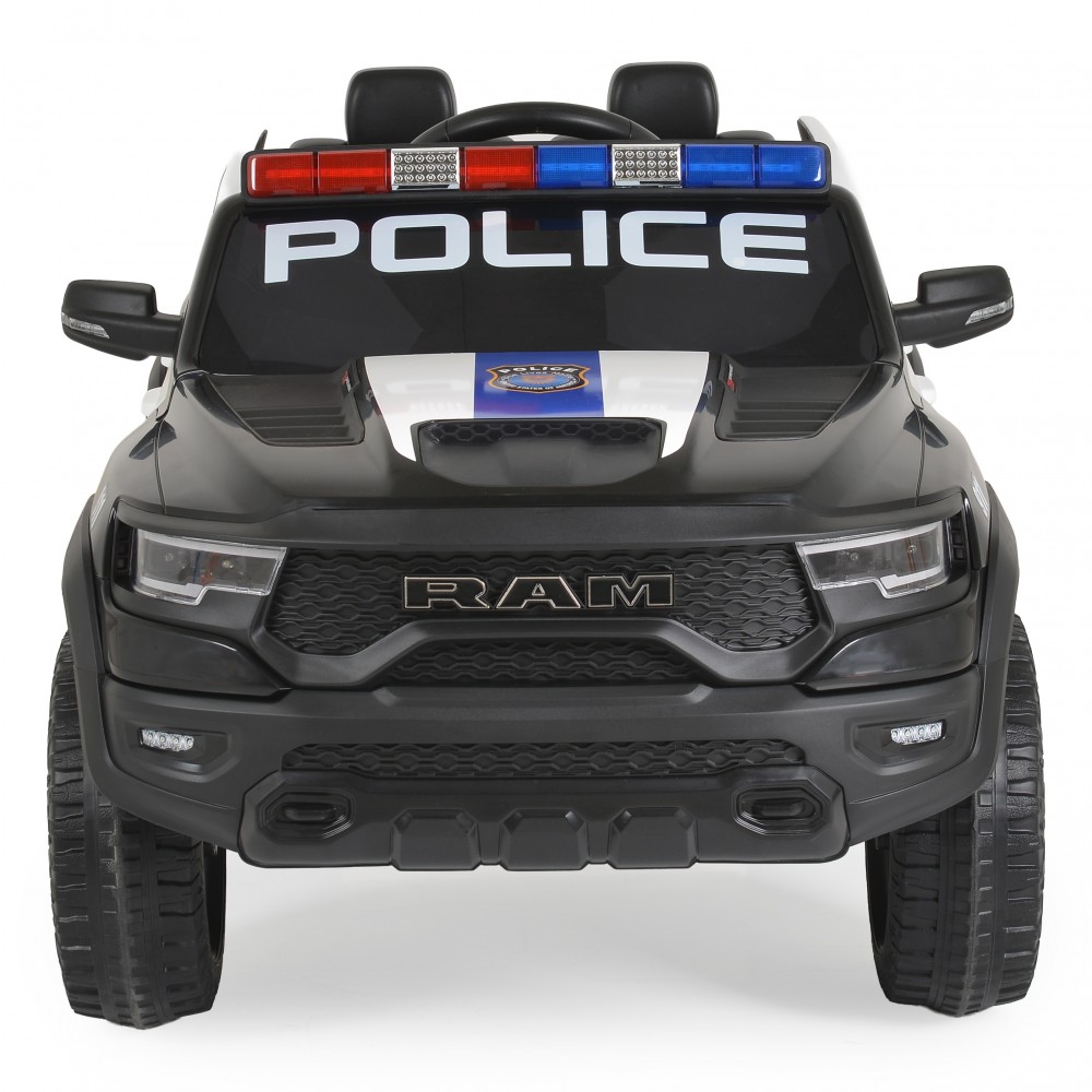 7463165-1000x1000 | La Vie en Rose Front view of a black toy police SUV with red/blue light bar and 'POLICE' lettering on the windshield window.