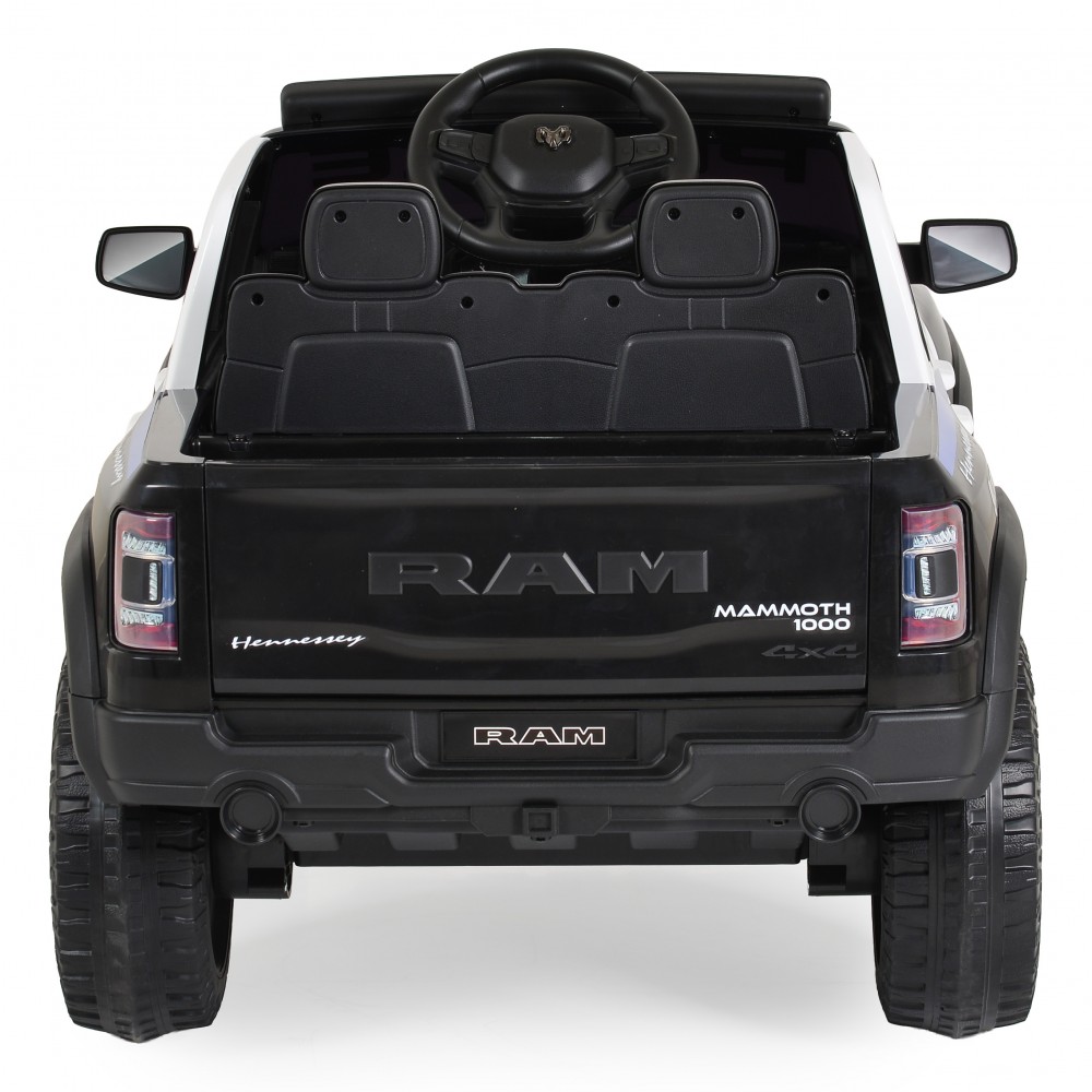 7463166-1000x1000 | La Vie en Rose Rear view of a black RAM Mammoth 1000 4x4 pickup toy/model with visible RAM branding on the tailgate and rear lights.