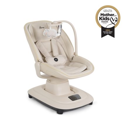 Beige infant rocker with padded seat and five‑point harness on a rounded base; award badge in the top-right corner.