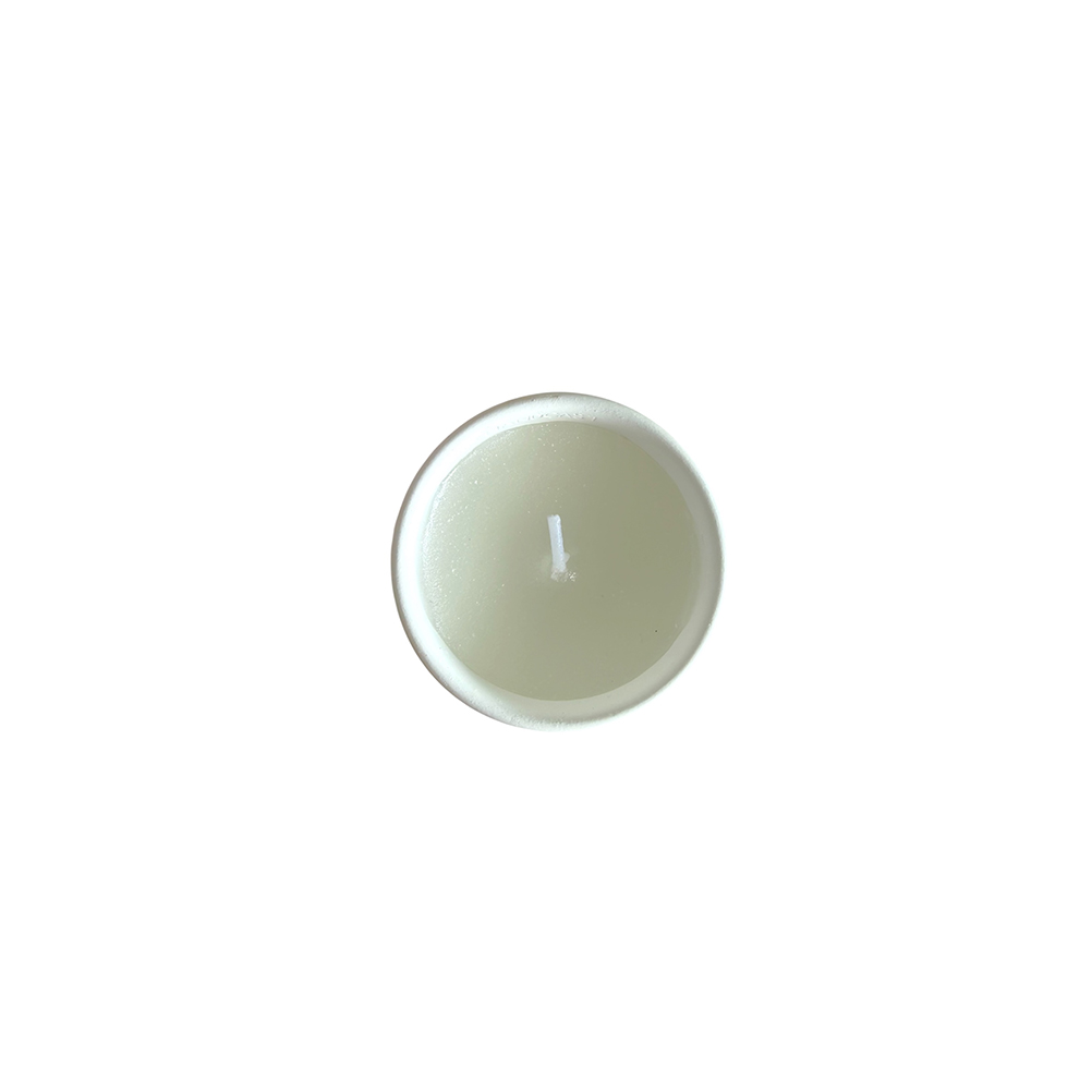 75256E37-1B01-B0B1-B99D-019F471DA477_21 | La Vie en Rose Top view of a small round tealight candle in a metal cup, unlit.