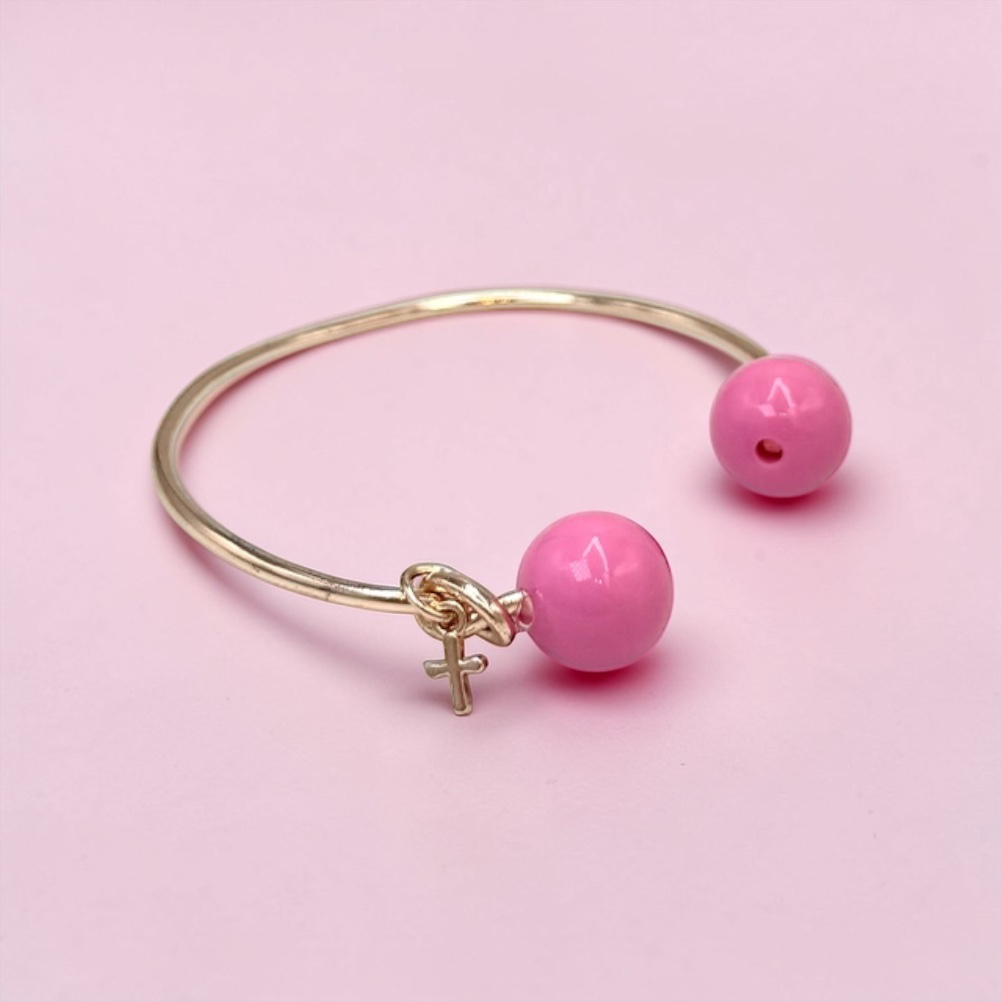 8466FE9F-AC6D-C353-ACDD-019CE6C34BEB_11 | La Vie en Rose Open silver bracelet with two pink beads and a small female symbol charm, set on a pale pink background.