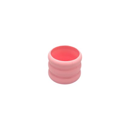 Pink silicone collapsible cup, compact travel cup with a ridged exterior, open top ready for use