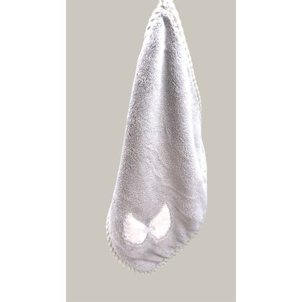Gray plush baby blanket with a small white bow at the corner.