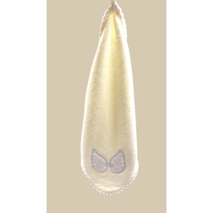 White sanitary pad with wings on a beige background, shown vertically.