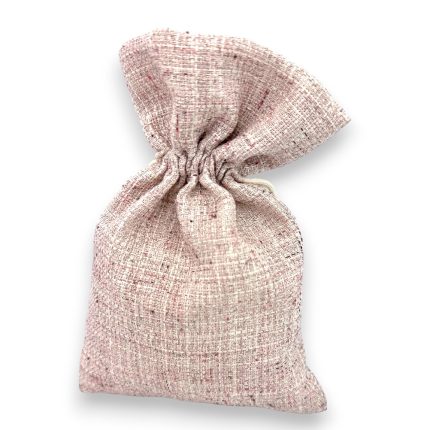 A beige burlap sack tied in a knot at the top with a soft shadow on a white background.