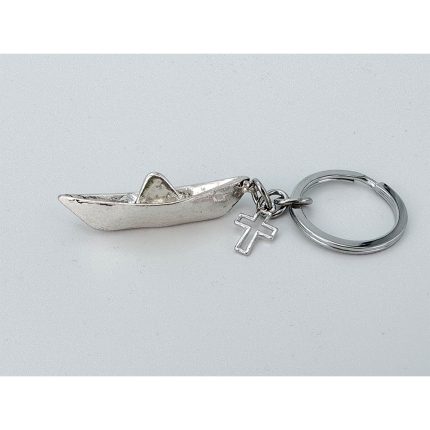 Silver keychain with a small boat charm and a dangling cross pendant on a split ring.