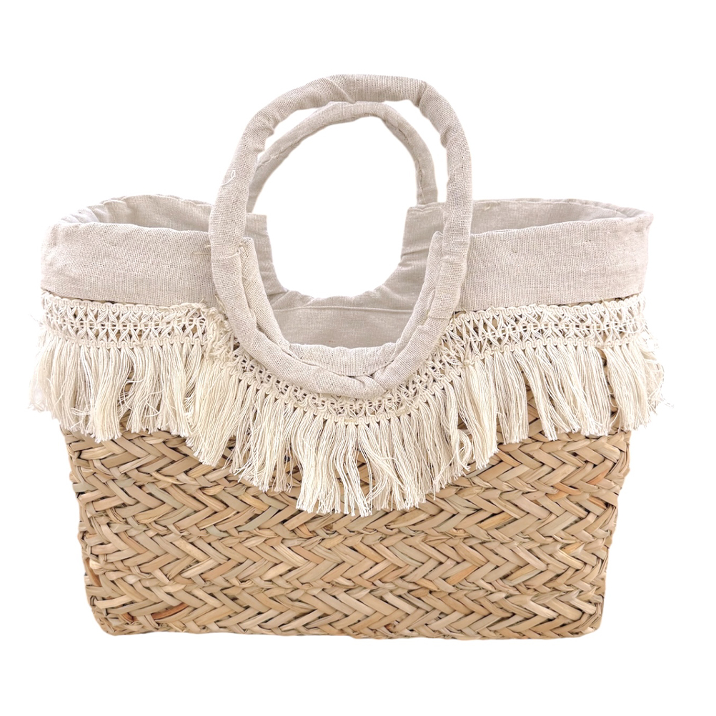 C0C4BD82-8FA8-B90B-51CF-019DB0538F52_11 | La Vie en Rose Woven straw tote bag with a cream fabric top and fringe trim along the edge, two rounded handles made of fabric.